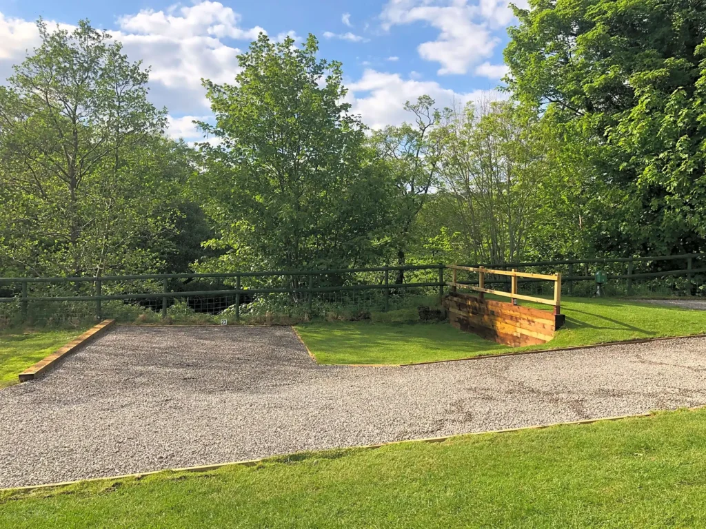 Fully-serviced hardstanding and grass touring pitch (super)