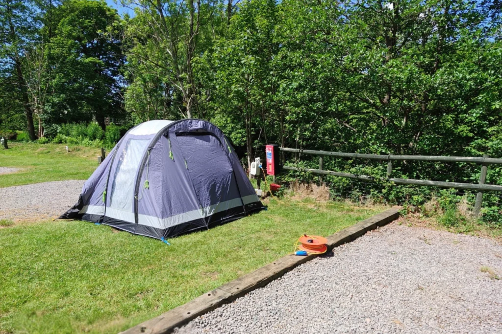 The Old Post Office Campsite in Lake District - Electric hardstanding and grass campervan pitch
